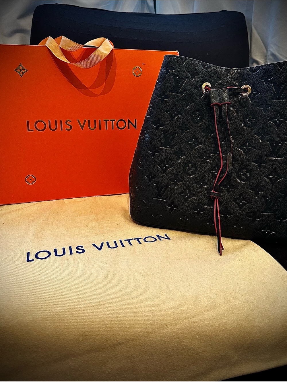 Authentic Louis Vuitton NeoNoe MM Black Monogram Empreinte Leather Red Interior